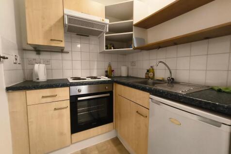 Compact and functional kitchen with light wood ...