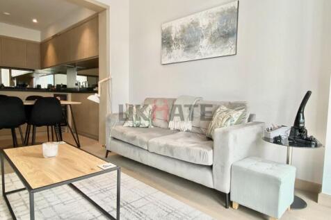 A bright and modern living room featuring a com...