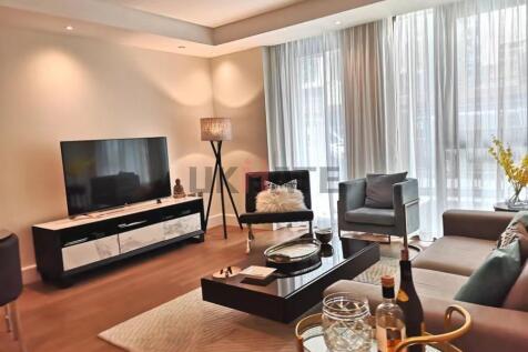 Bright and stylish living room featuring contem...