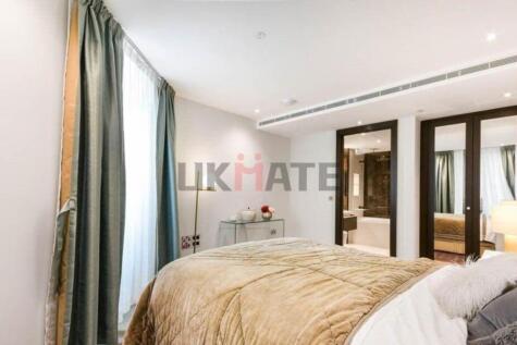 Bright and spacious master bedroom featuring a ...