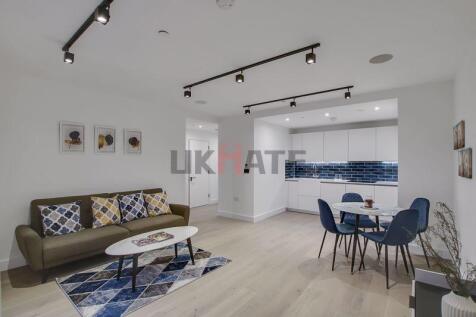Bright and modern living area with ample natura...