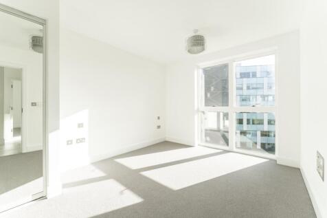 Bright and airy double bedroom featuring large ...
