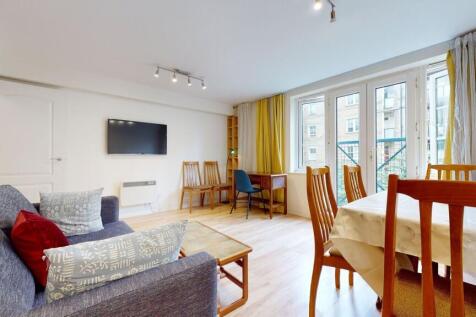 Bright and spacious living area featuring large...