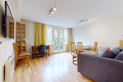Bright and airy living room bathed in natural l...