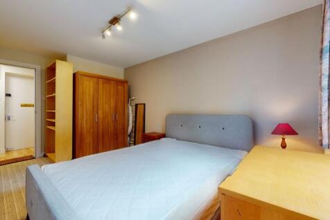 A bright and inviting double bedroom featuring ...