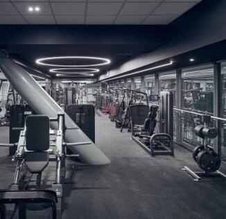 Modern gym with a variety of exercise equipment...
