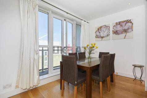 Bright and spacious living room with large wind...