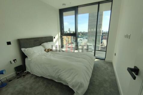 Modern bedroom featuring a comfortable double b...