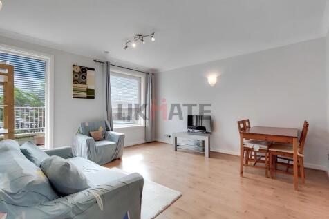 Bright and welcoming living room with large win...