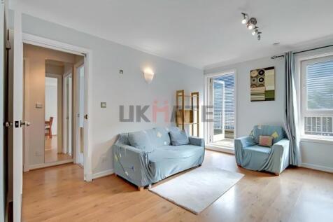 Bright and inviting living room with large wind...