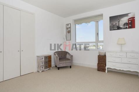 Bright and airy living room with a large window...