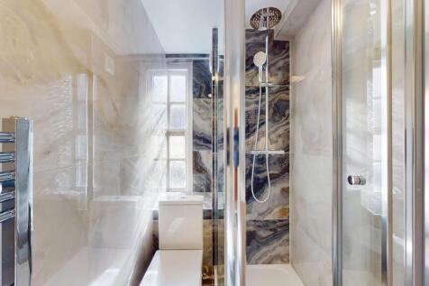 A modern, well-maintained bathroom featuring a ...