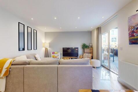 Bright and spacious living room with modern dec...