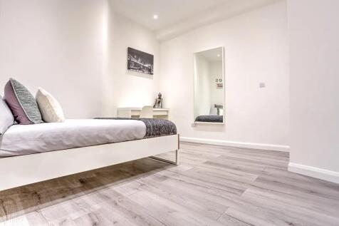 Bright and clean single bedroom featuring moder...