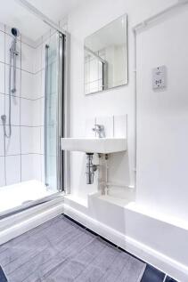 Bright and clean modern bathroom featuring a sp...
