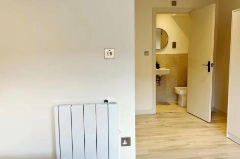 A clean and modern bathroom featuring a sink wi...