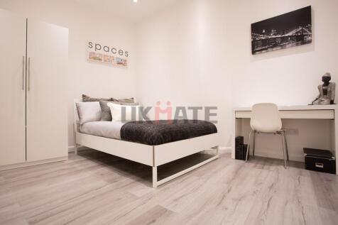 A bright and modern double bedroom featuring a ...