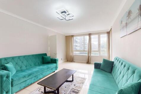 Bright and spacious living room with large wind...