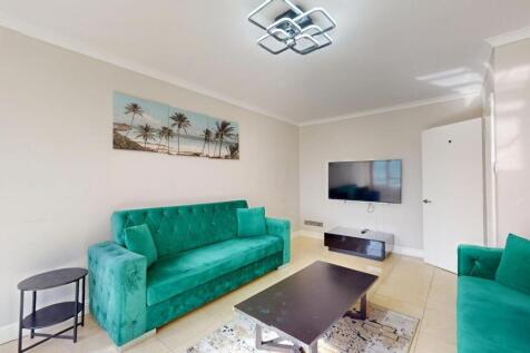 Bright and inviting living room featuring vibra...