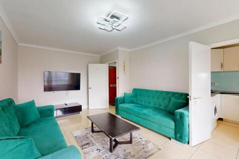 Bright and spacious living room featuring two v...