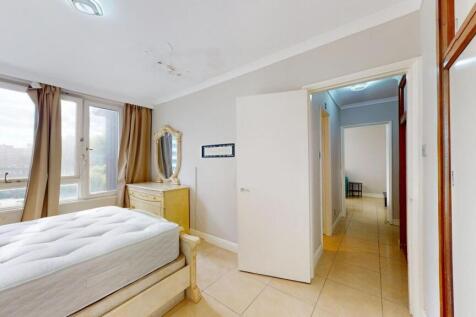 Bright and airy bedroom with large windows lett...