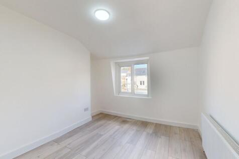 Bright and airy bedroom with fresh white walls,...