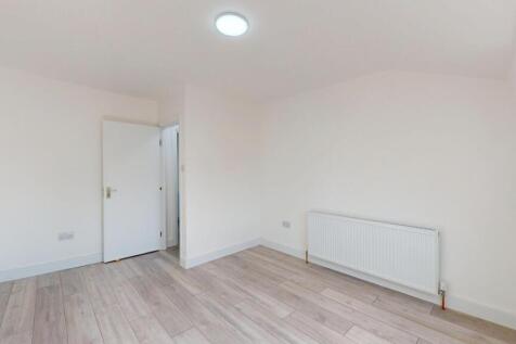 Bright, freshly painted bedroom with neutral fl...