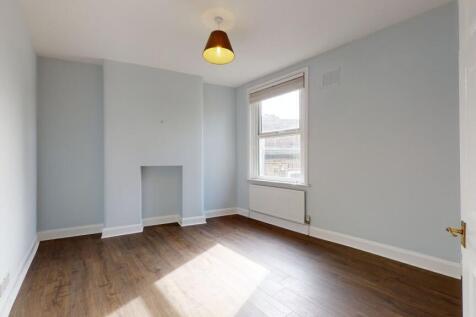 Bright and spacious master bedroom featuring so...