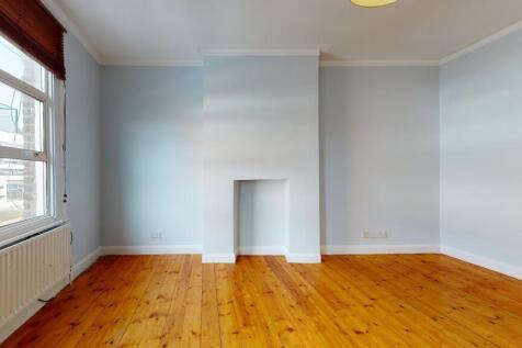 Bright and spacious bedroom featuring polished ...