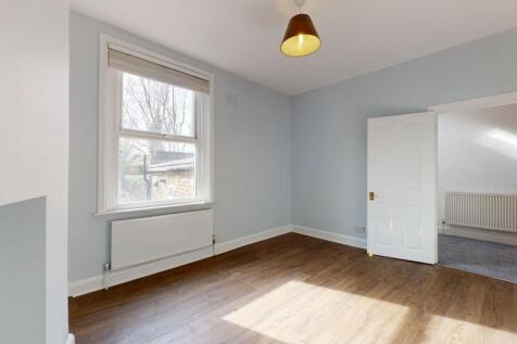 A bright and clean double bedroom featuring a l...