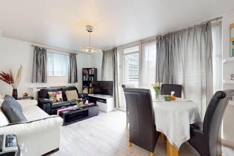 Bright and welcoming living room with large win...