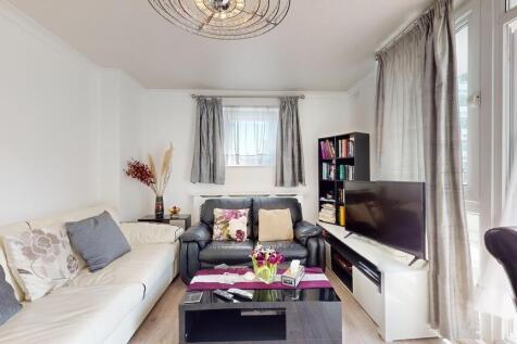Bright and welcoming living room featuring comf...