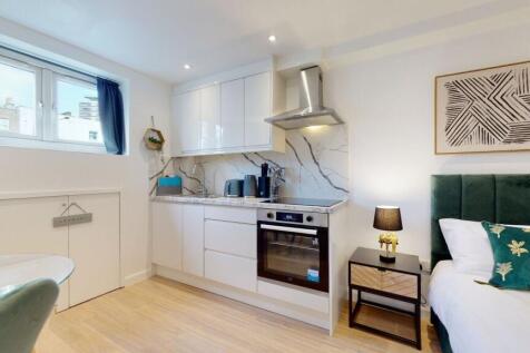 Bright and modern studio space featuring a slee...