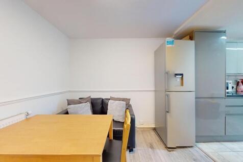 A modern kitchen with sleek grey cabinetry, a f...