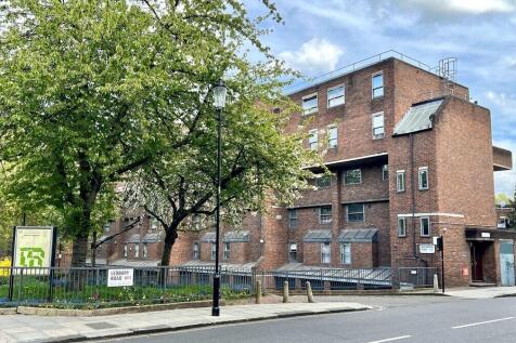 A charming brick residential building situated ...