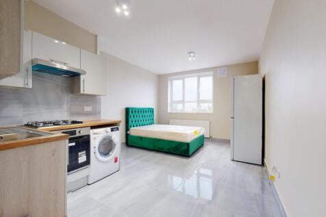 Bright and modern kitchen featuring integrated ...