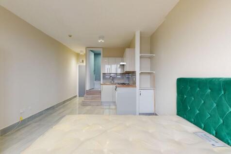 Bright and tidy living room featuring a vibrant...