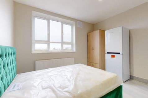 Bright and inviting master bedroom with a bold ...