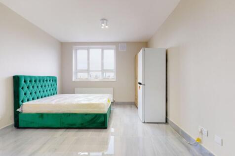 Bright and modern single bedroom featuring a vi...