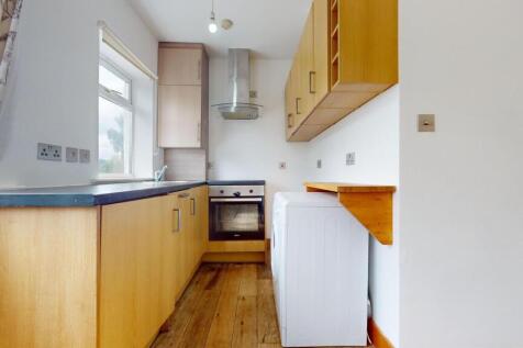 Bright and functional kitchen with ample natura...