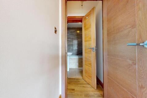 A clean and modern bathroom with a toilet and s...