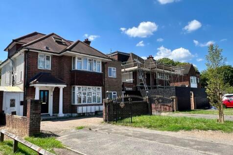 Exterior view of a traditional brick house with...