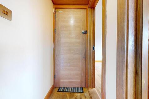 Neat, well-maintained entry hallway with a soli...