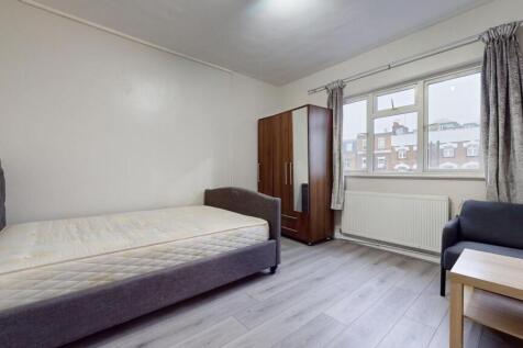 A bright and tidy double bedroom featuring a co...