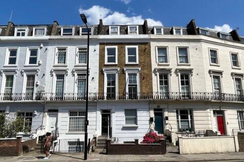 A charming row of classic terraced houses with ...