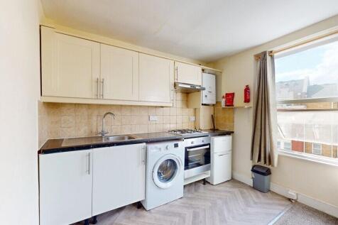 Bright kitchen with a large window letting in n...