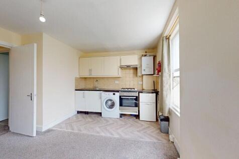 Bright and functional kitchen area featuring mo...
