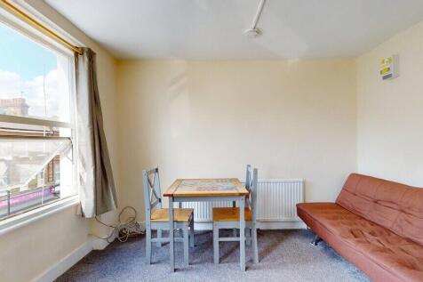 A cozy living room with a large window letting ...
