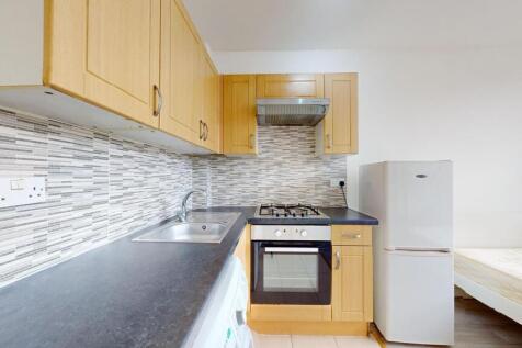 A well-organized kitchen featuring wooden cabin...