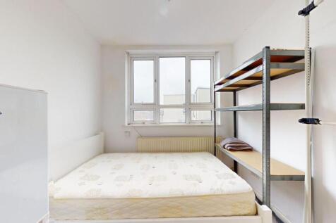 Bright and simple double bedroom featuring a la...